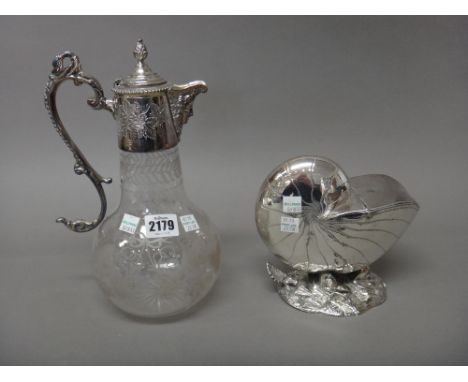 A silver plated metal mounted glass claret jug, the spout formed as a Bacchus mask, the handle with a swan's head finial and 