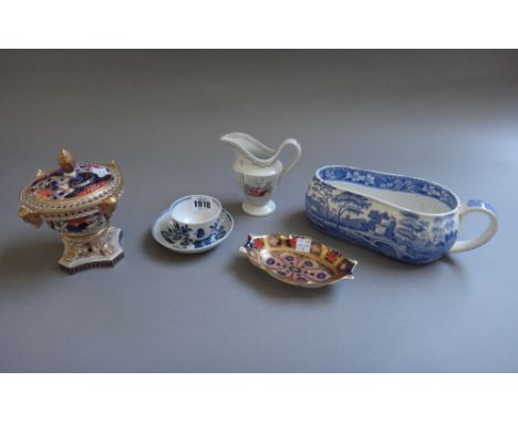 A Worcester porcelain blue and white tea bowl and saucer, circa 1770, printed with `The Three Flowers' pattern, together with