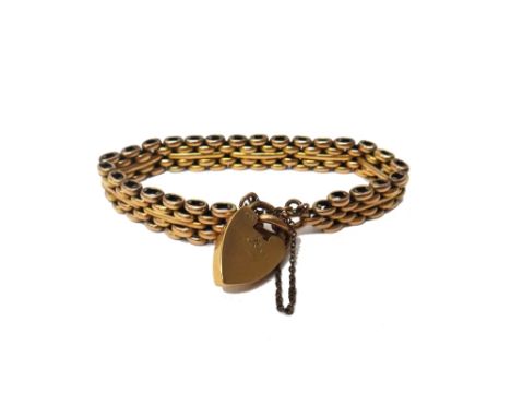 A gold bar and oval link stylised gate bracelet, detailed 18 ct on an 18 ct gold heart shaped padlock clasp, Birmingham 1907,