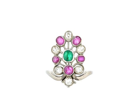 A diamond, ruby and emerald ring, in a bocage cluster design, collet set with cushion shaped diamonds and with variously cut 