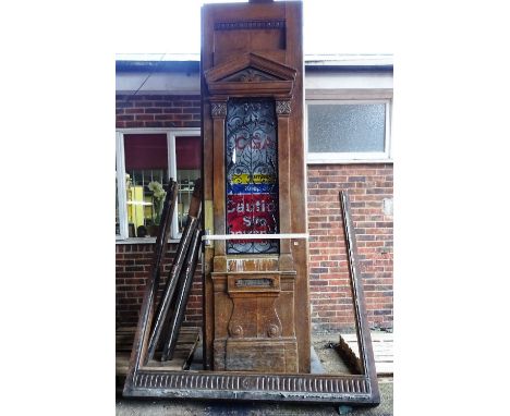 An extremely large pair of oak external doors and frame, each with raised architectural mouldings and wrought iron mounted gl