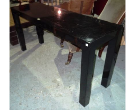 A 20th century ebonised rectangular console table, on square tapering supports, 153cm wide x 76cm high.