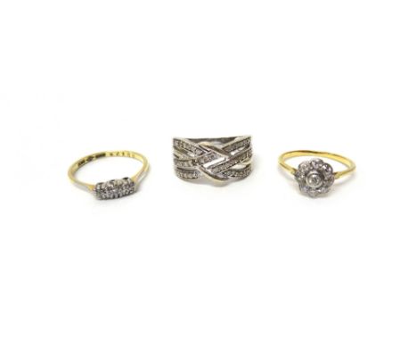 A gold and diamond set nine stone cluster ring, mounted with cushion shaped diamonds, a gold and platinum, diamond set three 