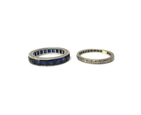 A sapphire set full eternity ring, mounted with square step cut sapphires, ring size M and a half and a diamond set eternity 