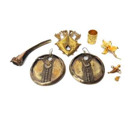 A gold and imitation pearl brooch, designed as a flower, detailed 18 K, a gold charm, designed as a jambyia and a group of fu