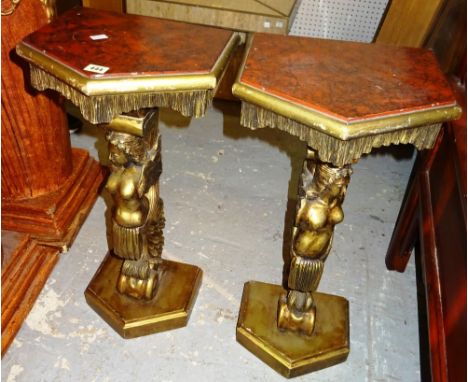 A pair of 20th century giltwood console tables, with nude female figural supports, 34cm wide x 72cm high, (2).