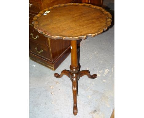 A George III mahogany tripod table, with pie-crust top, on acanthus curved supports, 45cm wide x 70cm high.