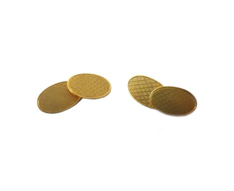 A pair of 18ct gold oval cufflinks, having engine turned decoration, Birmingham 1930, weight 8.8gms.