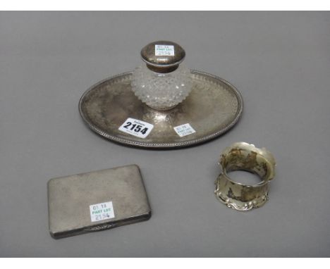 Silver, comprising; a Victorian oval inkstand, with foliate and scroll engraved decoration, within a beaded border, fitted wi
