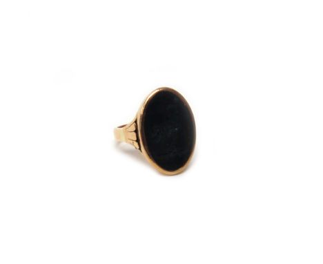 A gold and bloodstone set oval signet ring, seal crest engraved with a bird with a key in its beak, ring size P.