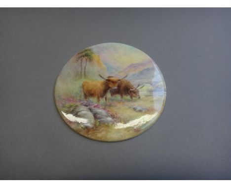 A Royal Worcester circular plaque by Harry Stinton, circa 1920, depicting highland cattle grazing in a landscape, signed and 