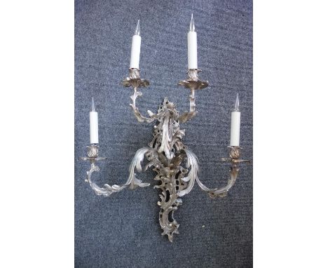 A Rococo revival silver painted four branch girandole wall light, 65cm high, excluding fittings. 56cm high.