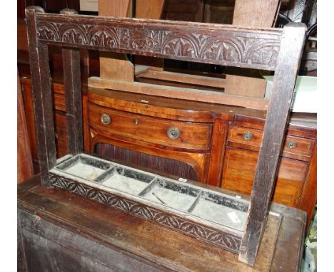 An 18th century oak four division stick stand with foliate carved bottom rail, 80cm wide x 64cm high. 