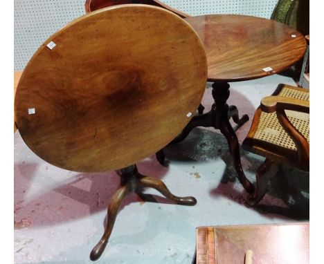 A George III mahogany tripod table, on outswept supports, 77cm wide x 70cm high, together with a George II mahogany tripod ta