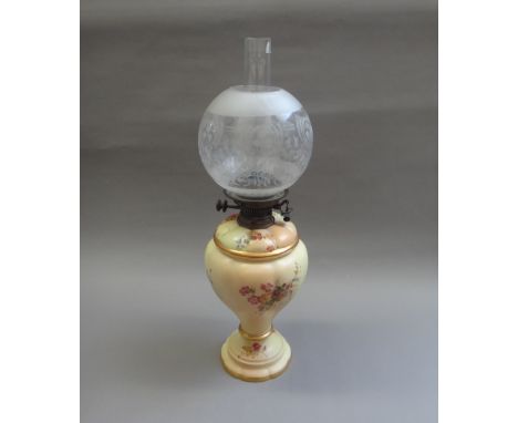 A Royal Worcester blush ivory ware oil lamp, late 19th century, of lobed footed form, with a Hinks burner and later globular 