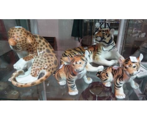 Four Russian ceramic animals; three tigers and a leopard, (4).