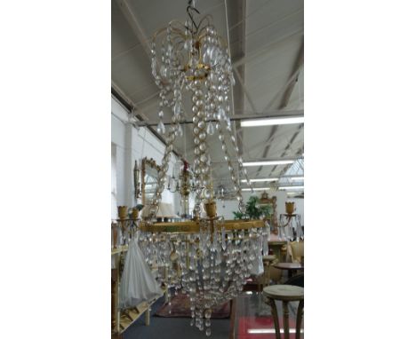 A North European ormolu and cut glass six light chandelier of Louis XVI style, 20th century, the three graduated circlets uni