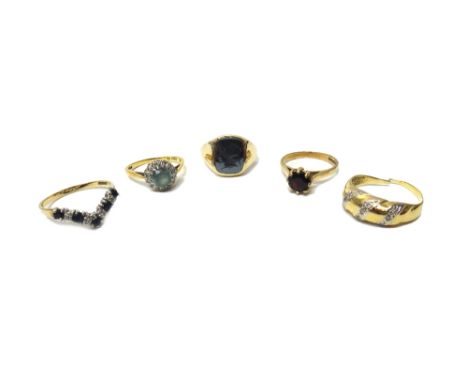 An 18ct gold, diamond and blue zircon set cluster ring, a 9ct gold and garnet set single stone ring, a 9ct gold and haematite