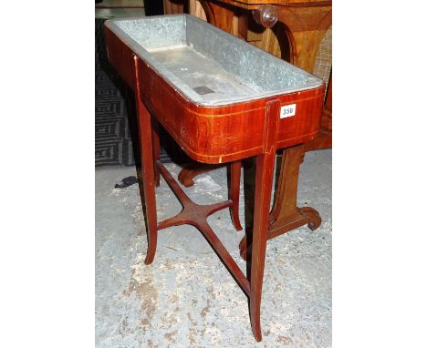 An Edwardian mahogany rectangular planter inset with metal, on outswept supports, 67cm wide x 62cm high, together with a nest