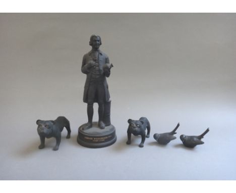 Two Wedgwood black basalt bulldogs, circa 1913-30, modelled by Ernest Light, each with inset glass eyes, unmarked,  10.5cm, t