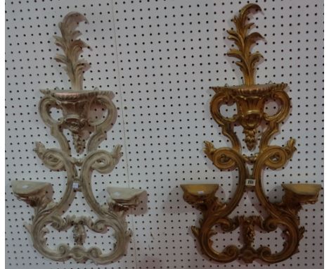 A gilt wooden three tier wall shelf with acanthus scroll, and another similar, (2). 