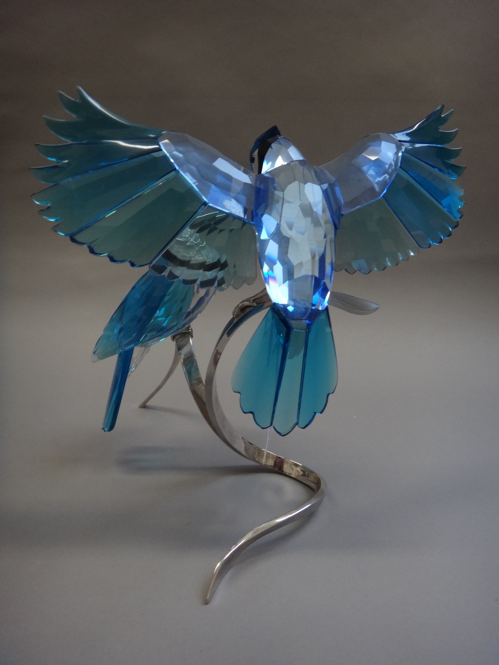 A Swarovski crystal 'Blue Jays' centrepiece, modelled with two birds ...