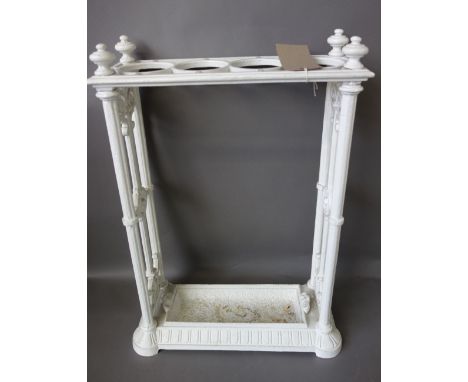 A Victorian cast iron stick stand, white painted, with four circular divisions and a removable drip tray,63cm high, an Irish 