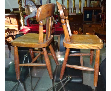 A pair of 20th century elm child's stick back chairs, (2).