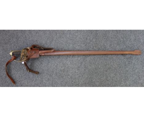 An English officer's sword, with single edged engraved steel blade (82cm long) detailed 'F.C Scott, London', with a brass hil