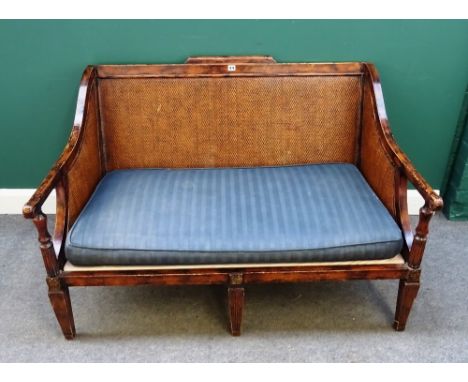 An 18th century plantation style hardwood framed sofa with rush back and sides on channeled tapering square supports. 130cm w