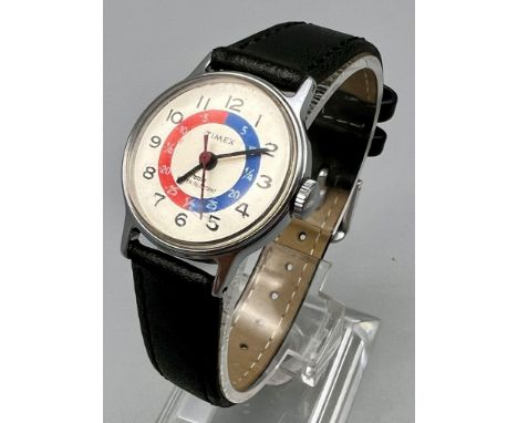 A Rare Vintage Timex Time Teacher Mechanical Watch. Black leather strap. Case - 23mm. In good condition and working order. 