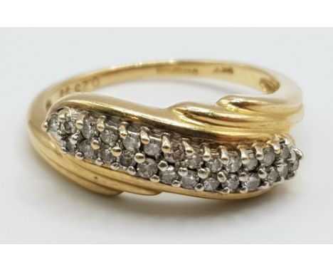 A 9 K yellow gold ring with a double diamond (0.25 carats) twist. Ring size: N1/2, weight: 3.1 g. 