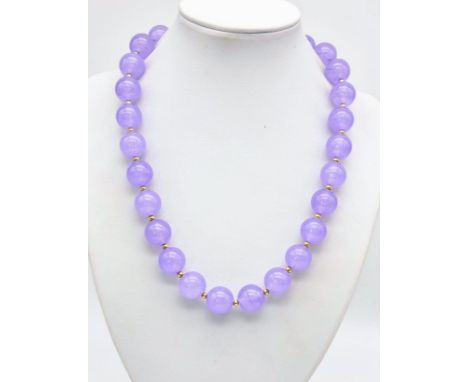 A Lavender Jade Beaded Necklace. Gilded spacers and clasp. 42cm 