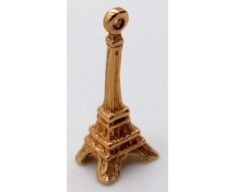 A 9 K yellow gold charm/pendant of the EIFFEL TOWER, PARIS, Height: 20 cm, weight: 1.2 g. 
