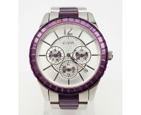 A Guess Chronograph Ladies Watch. Purple and steel strap and case - 40mm. Quartz movement in working order. 