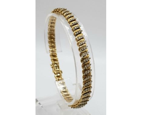 A 9 K yellow gold bracelet with oblong diamond (1.10 carats) bands. Length: 19 cm, weight: 134.7 g. 