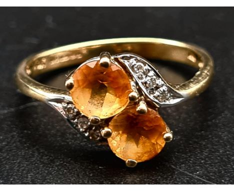 A 9K Yellow Gold Citrine and Diamond Ring. Size K 1/2.1.68g total weight. 