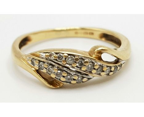 A 9 K yellow gold ring a couple of twisted diamond bands on top. Ring size: M1/2, weight: 2.2 g. 