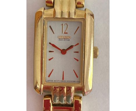 Ladies CITIZEN ECO DRIVE wristwatch in Gold tone with tank style case and matching gold tone gate bracelet. Full working orde