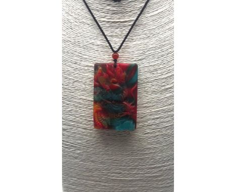 A Multi-Coloured Carved Dragon Image Style Jade Pendant. 6 x 4cm. 