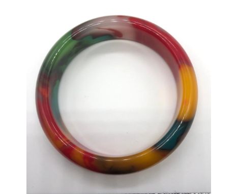 A Multi-Coloured Jade Bangle. 6cm inner diameter. 