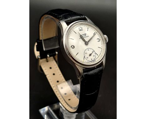 A Vintage Tissot Antimagnetic Watch, Cal.27 movement. Black leather strap. Case - 30mm. White dial with sub second dial. In w