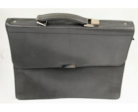 A Simpson of London Silver Carbon Leather Briefcase. 16 x 13 inches. Unused, but some small signs of shop wear and tear so pl