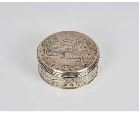 A William IV silver gilt circular snuff box Thomas Whitehead, London, 1833, repoussé decorated with cottage in landscape, pul