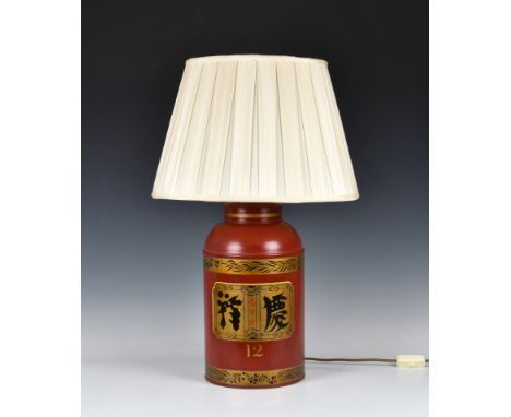 A Toleware style tea canister table lamp decorated in red with central square panel with Chinese script, and number '16' belo