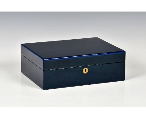 A modern blue stained wooden jewellery box rectangular form, the hinged lid, opening to reveal mirror and compartmental inter