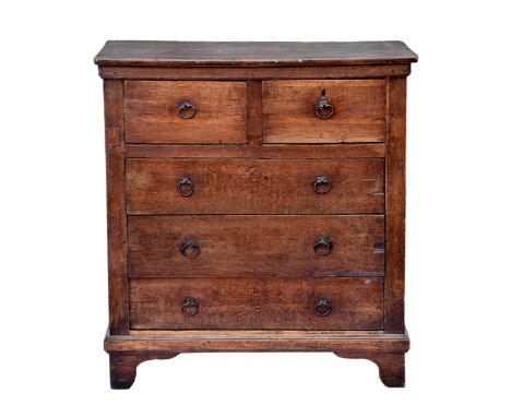 An 18th century joined oak and fruitwood provincial chest of drawers possibly Channel Islands, the fruitwood top over two pan