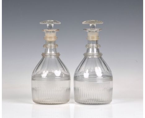 A pair of George III cut glass mallet decanters with triple annulated neck rings, the bodies with panel cut shoulders over a 