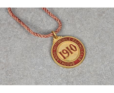 A 1910 Brooklands automobile racing club members badge numbered 105, by Vaughton.