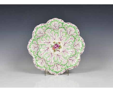 A First Period Worcester cabbage leaf dish c.1770, floral spray to centre, 10¾in. (26cm.) diameter.* Condition: Tiny firing f
